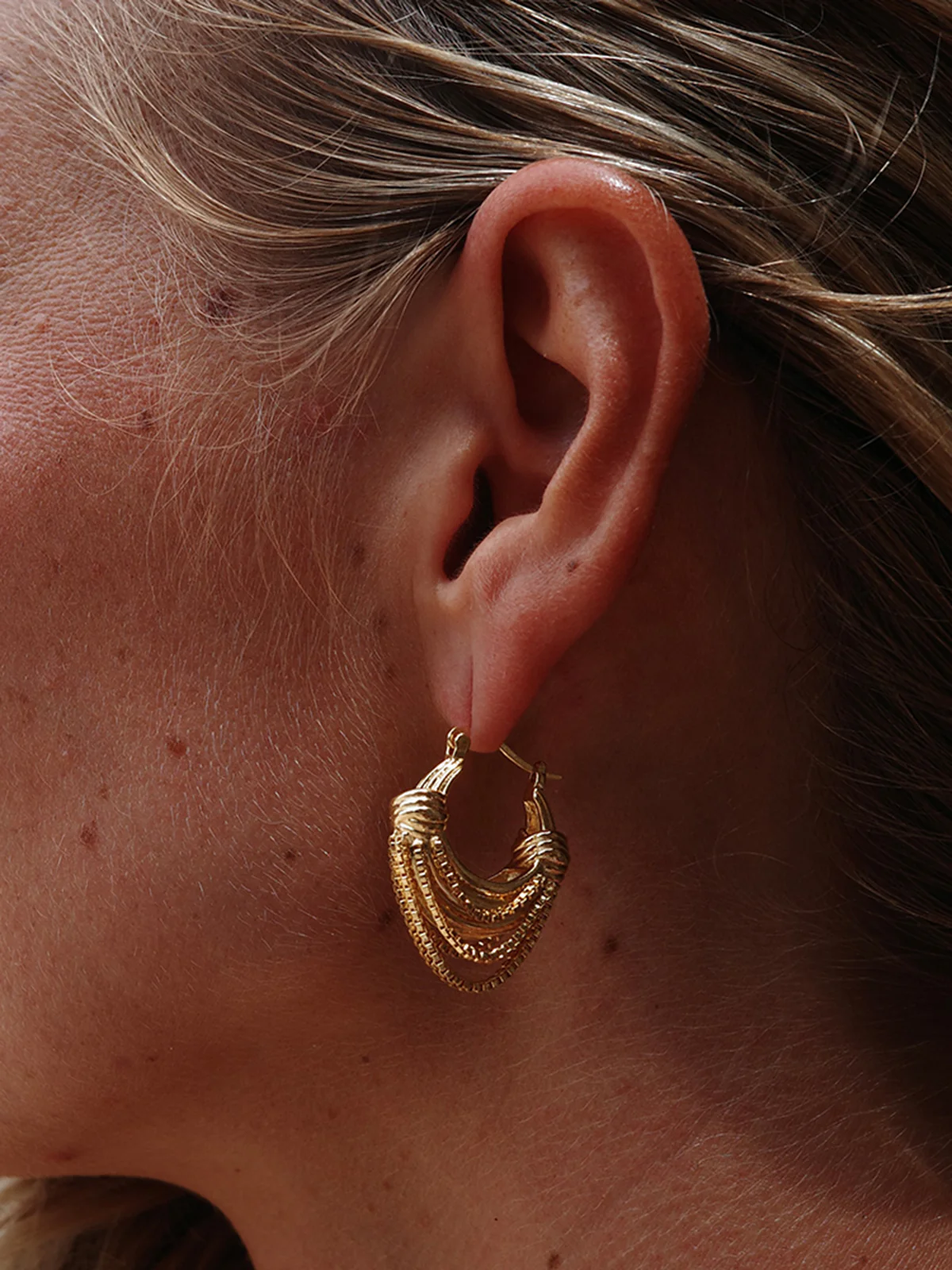 Golden Multi-Layered Hoop Earrings - Image 3