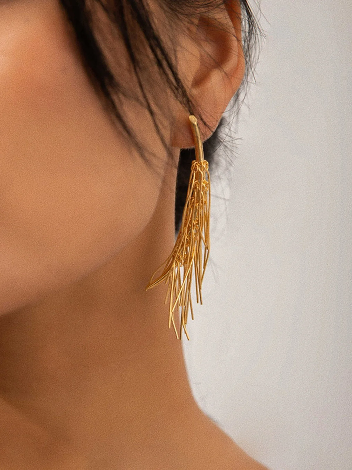 Golden Tassel Stud Earrings - Image 2